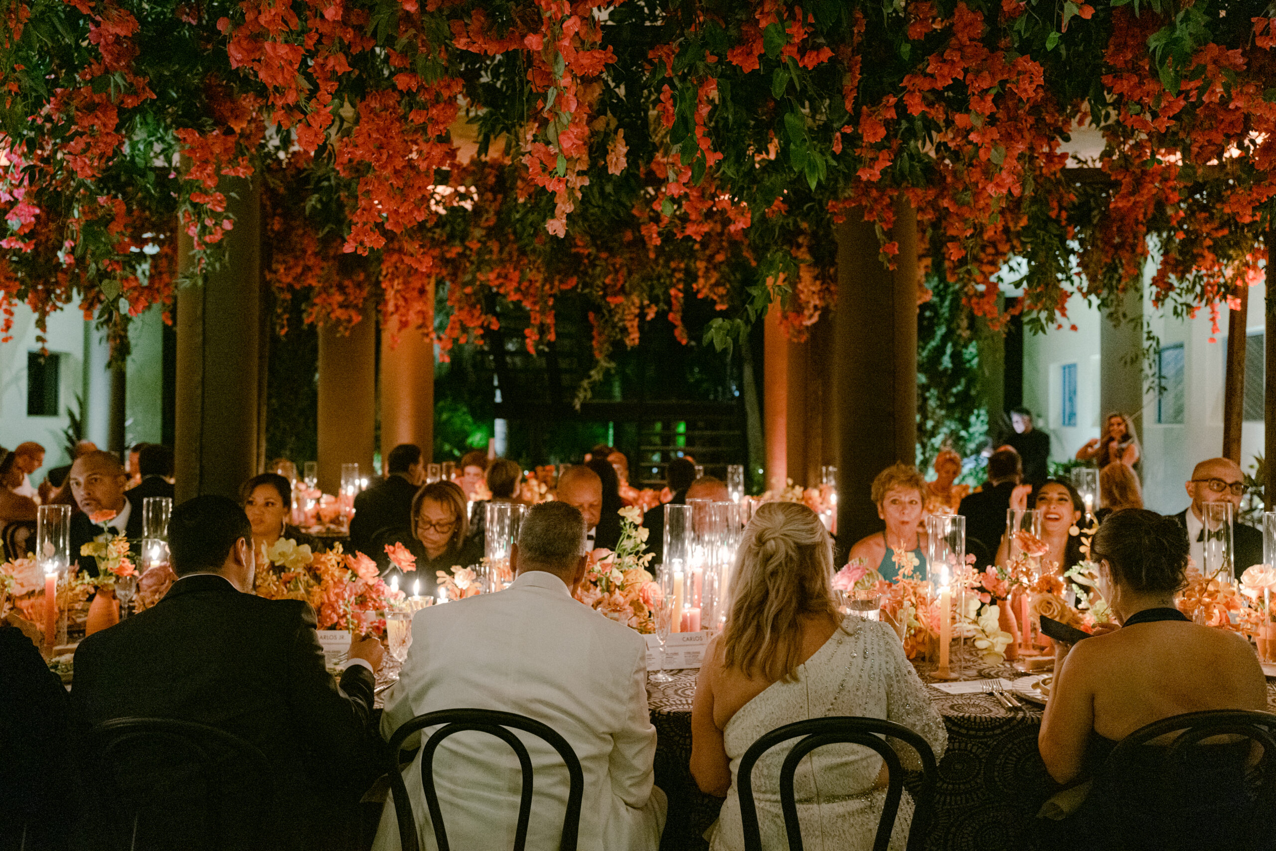 Destination wedding reception table under candlelight designed by Jennifer Buono Events, combining cocktail and seated settings